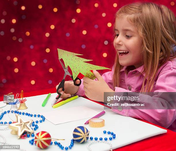 kind, dekoration - child cutting card stock-fotos und bilder