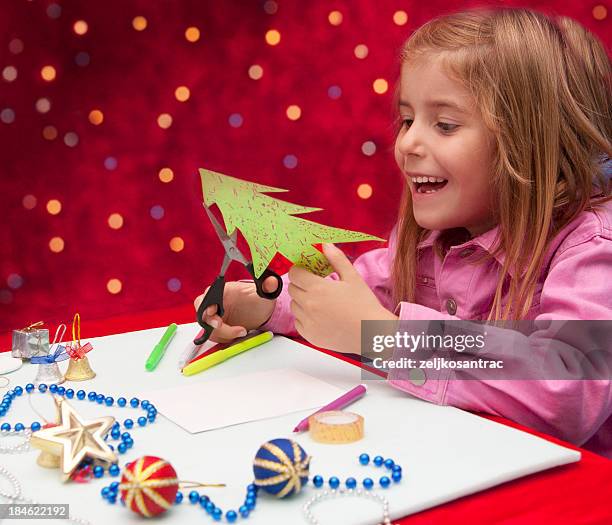 child making decoration - child cutting card stock pictures, royalty-free photos & images