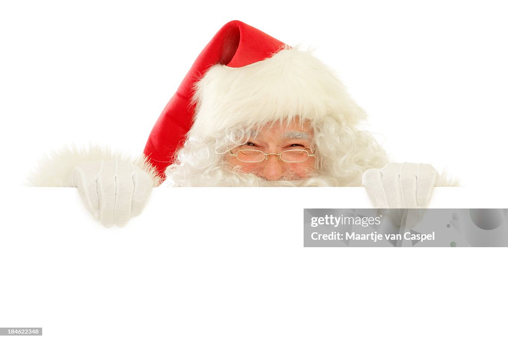 Santa Claus mit leere Schild glücklich Guckschlitzen