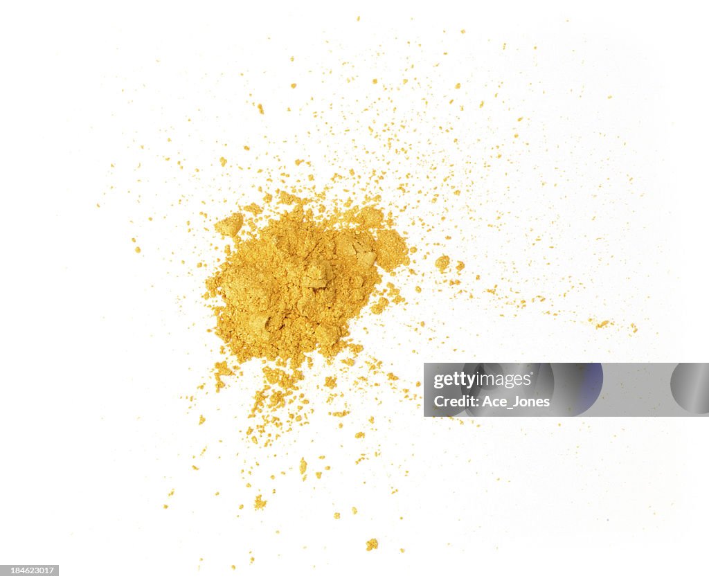 Gold eyeshadow powder isolated on white background