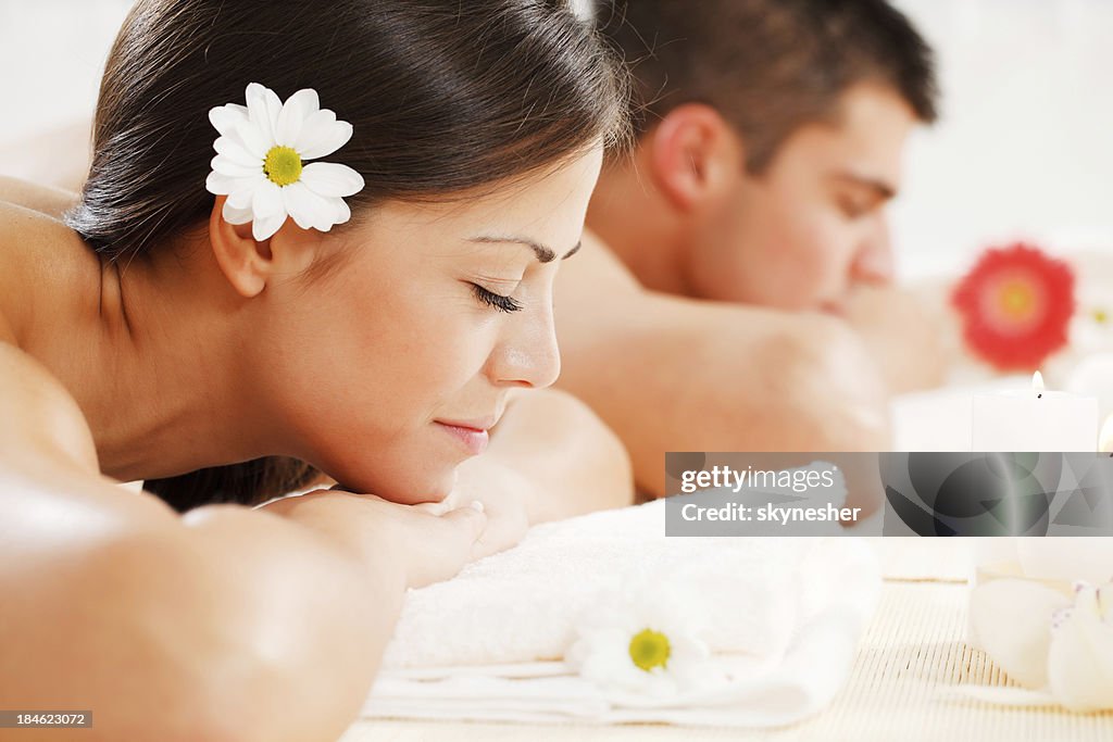Young couple is enjoying at spa centre.