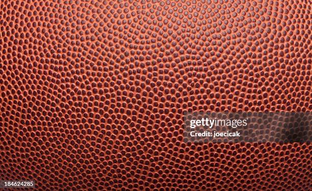 pigskin fondo de textura de fútbol - americana de cuero fotografías e imágenes de stock