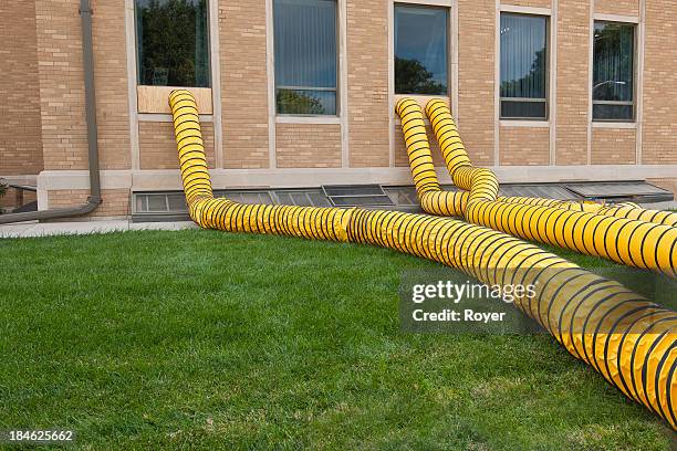 flood remediation tubes - flood cleanup stock pictures, royalty-free photos & images