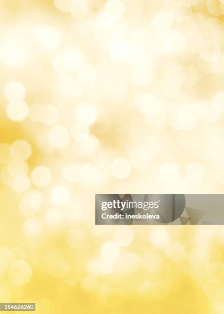 fading yellow and white dots of light - lights background stockfoto's en -beelden