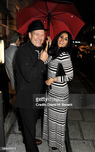 Paul Simonon and Serena Rees attend the London EDITION and NOWNESS dinner to celebrate ON COLLABORATION on October 14, 2013 in London, England.