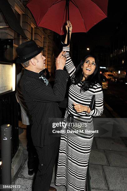 Paul Simonon and Serena Rees attend the London EDITION and NOWNESS dinner to celebrate ON COLLABORATION on October 14, 2013 in London, England.