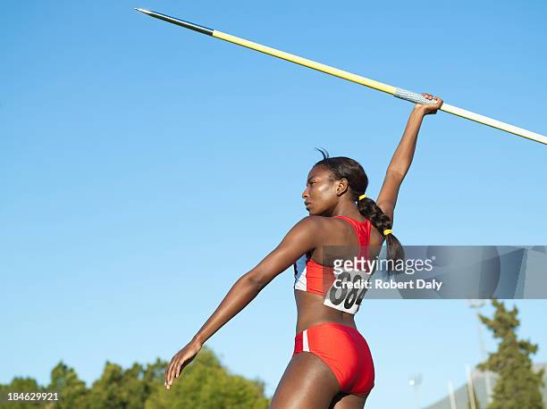 athlete with javelin in arena - javelin stock pictures, royalty-free photos & images