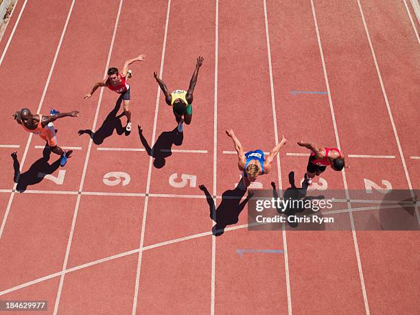 racers at the start line on a track - athlete defeat stock pictures, royalty-free photos & images