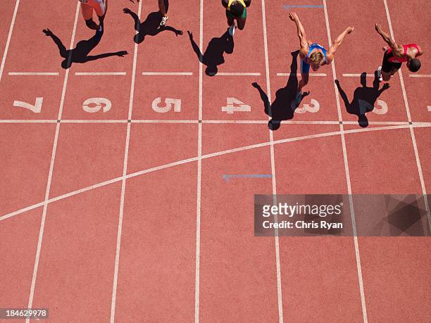 racers at the start line on a track - athlete defeat stock pictures, royalty-free photos & images