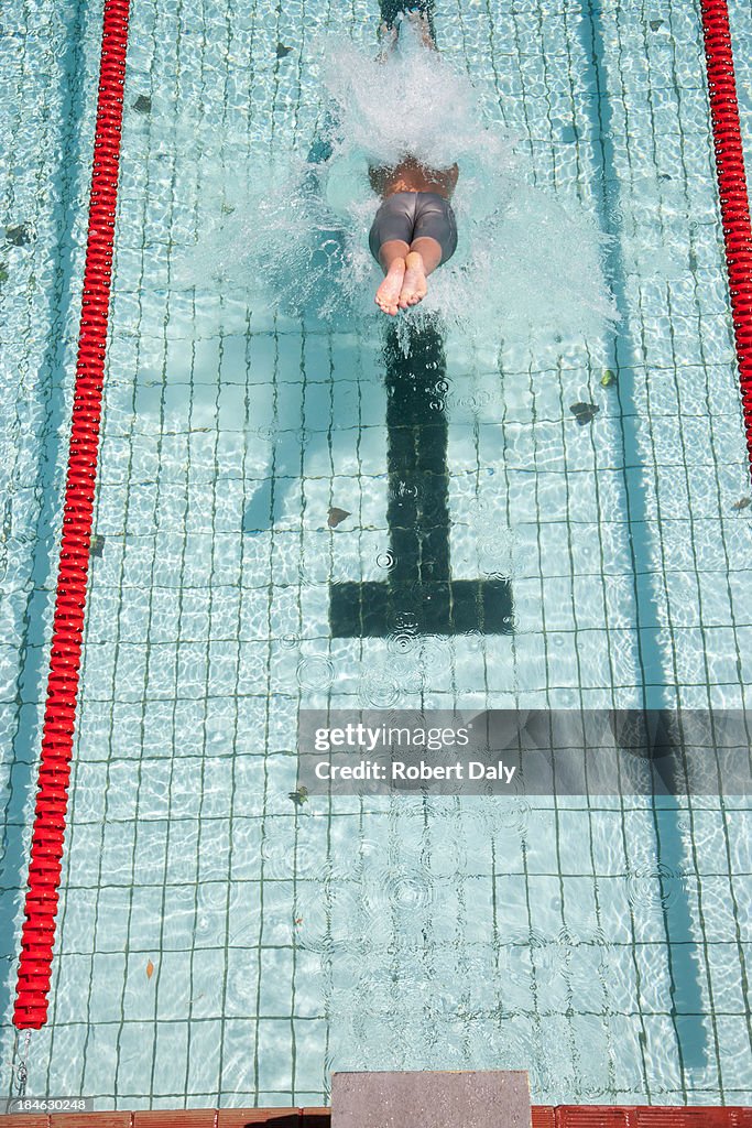 Swimmer diving in pool