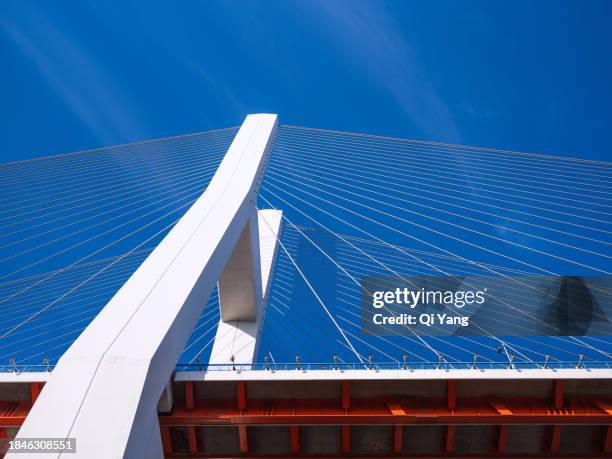 low angle view of red suspension bridge - regency frame stock pictures, royalty-free photos & images