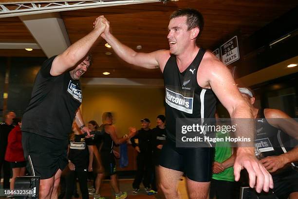 Television presenter James McOnie and rower Joseph Sullivan celebrate after winning the rowing leg of the ANZA Challenge on October 15, 2013 in...