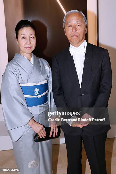 Artist Hiroshi Sugimoto with his wife Atsuko Koyanagi, standing front of his works attend Boucheron Hosts Hiroshi Sugimoto Exhibition Celebration at...