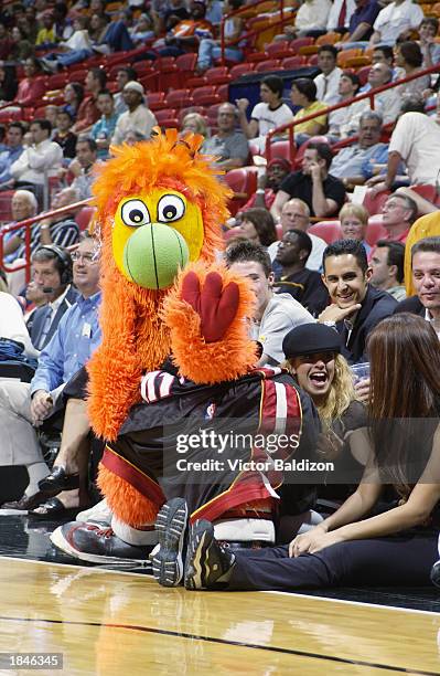 The Miami Heat mascot, Burnie, sits on a Heat Dancer during the game against the Milwaukee Bucks at American Airlines Arena on March 4, 2003 in...