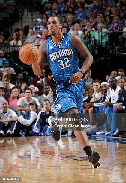 Kris Joseph of the Orlando Magic handles the ball against the Dallas Mavericks on October 14, 2013 at the American Airlines Center in Dallas, Texas....