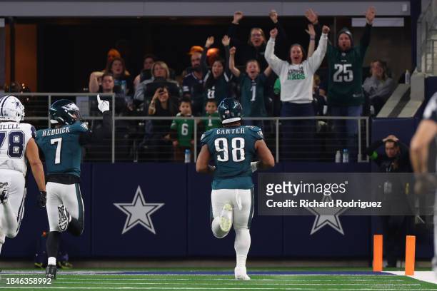 Jalen Carter of the Philadelphia Eagles returns a fumble for a touchdown during the third quarter against the Dallas Cowboys at AT&T Stadium on...