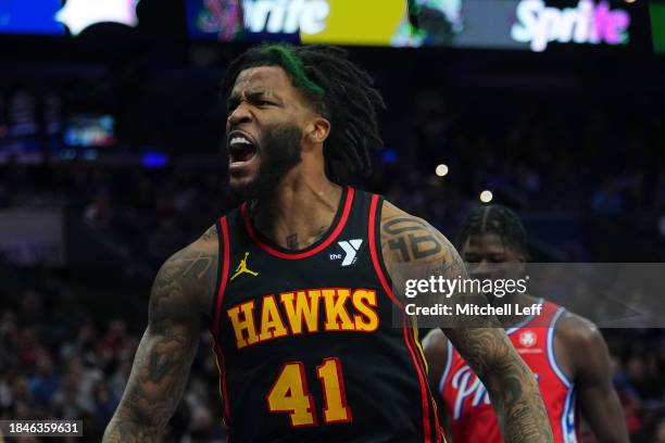 Saddiq Bey of the Atlanta Hawks reacts after dunking the ball against the Philadelphia 76ers at the Wells Fargo Center on December 8, 2023 in...