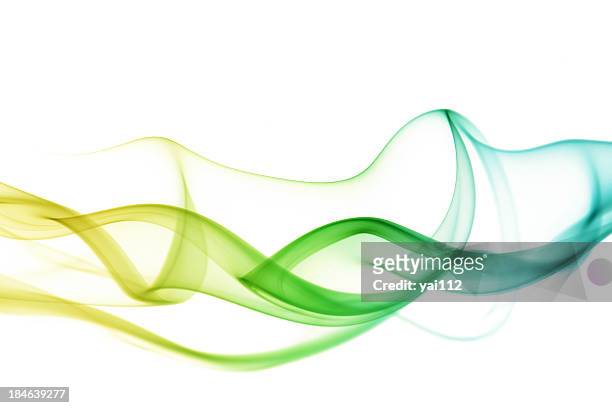 abstract smoky waves in green and yellow - yellow smoke stock pictures, royalty-free photos & images