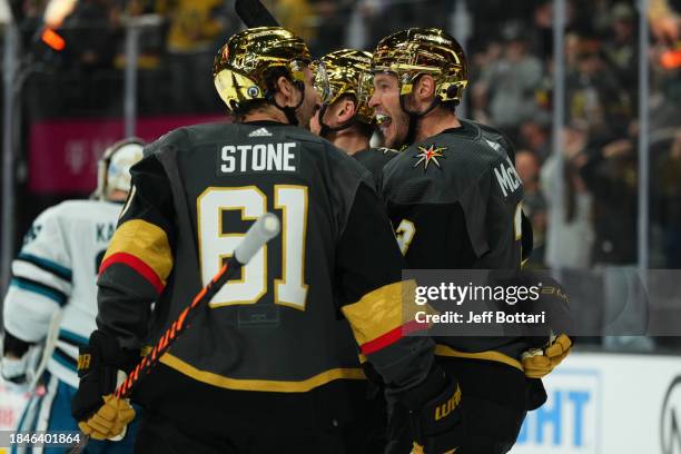 Brayden McNabb of the Vegas Golden Knights celebrates with Mark Stone and Jack Eichel after a goal during the third period against the San Jose...