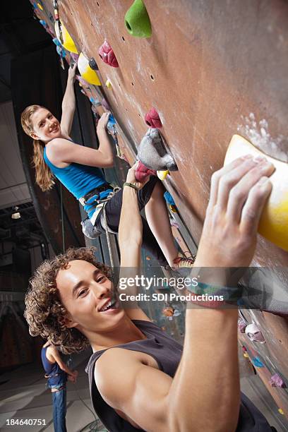 young rock climbers at the gym - crag stock pictures, royalty-free photos & images