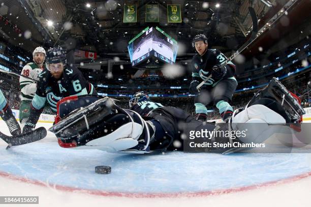 Adam Larsson of the Seattle Kraken watches a loose puck during the third period against the Minnesota Wild at Climate Pledge Arena on December 10,...