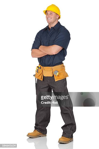 construction worker standing with his arms crossed - hard hat white background stock pictures, royalty-free photos & images