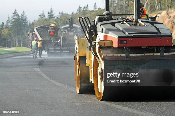 road construction - asphalt paver stock pictures, royalty-free photos & images