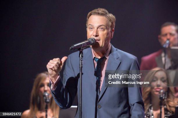 Michael W. Smith performs on stage during the Christmas Live concert at Smart Financial Centre on December 10, 2023 in Sugar Land, Texas.