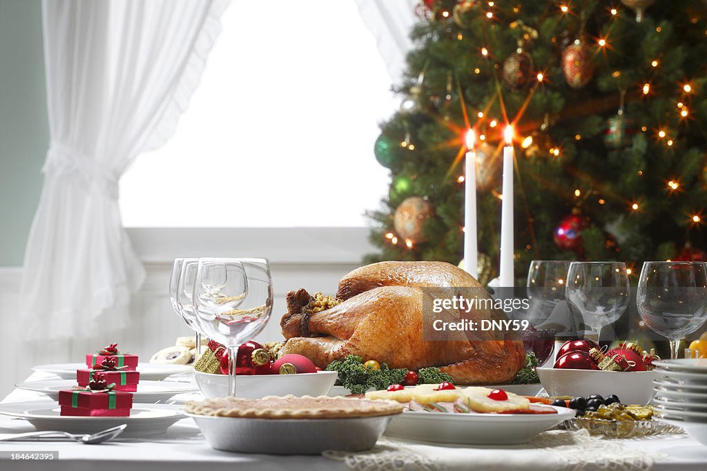 Christmas Dinner Table Spread and Christmas Tree