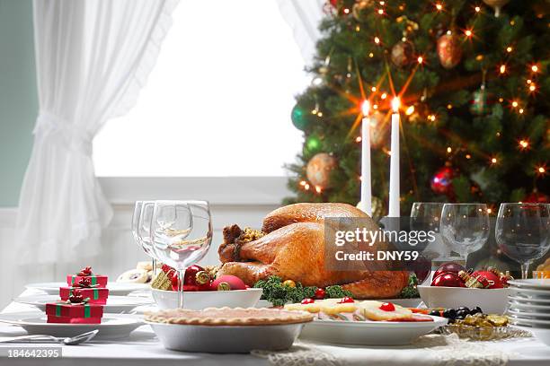 christmas dinner table spread and christmas tree - kalkon vitt kött bildbanksfoton och bilder