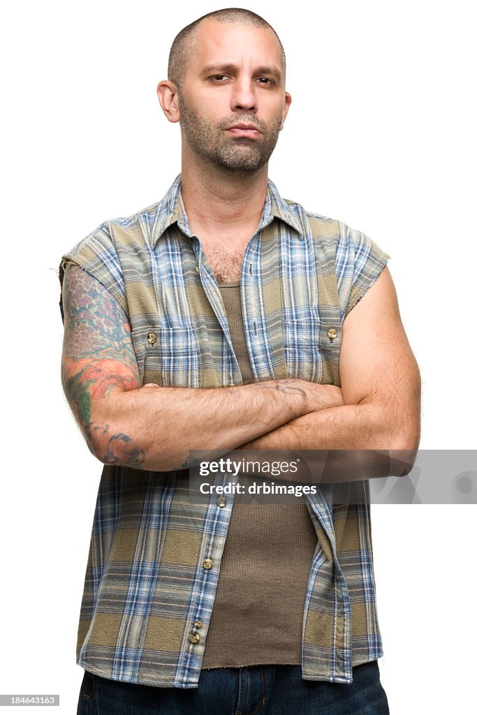 Portrait of a young man with tattoos in a checkered shirt