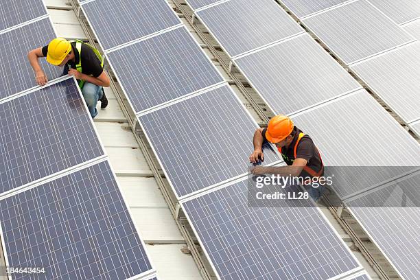 installing panels - solar panel installation stock pictures, royalty-free photos & images