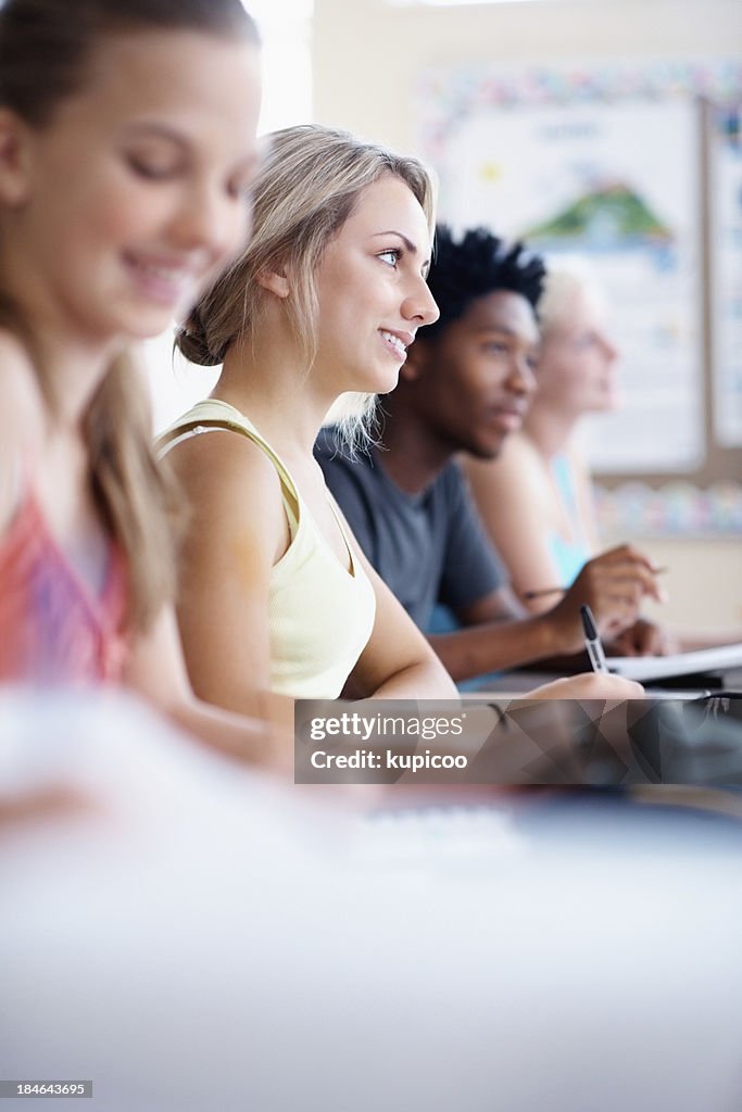 Classmates taking notes