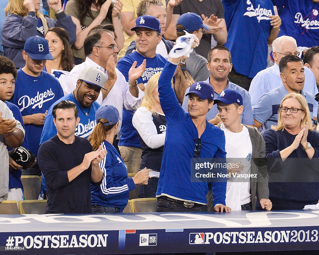Dodgers Robe Ice Cube, Robe Lowe and Matthew Edward Lowe attend Game Three of the ...