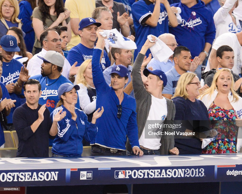 Dodgers Robe Ice Cube, Robe Lowe and Matthew Edward Lowe attend Game Three of the ...