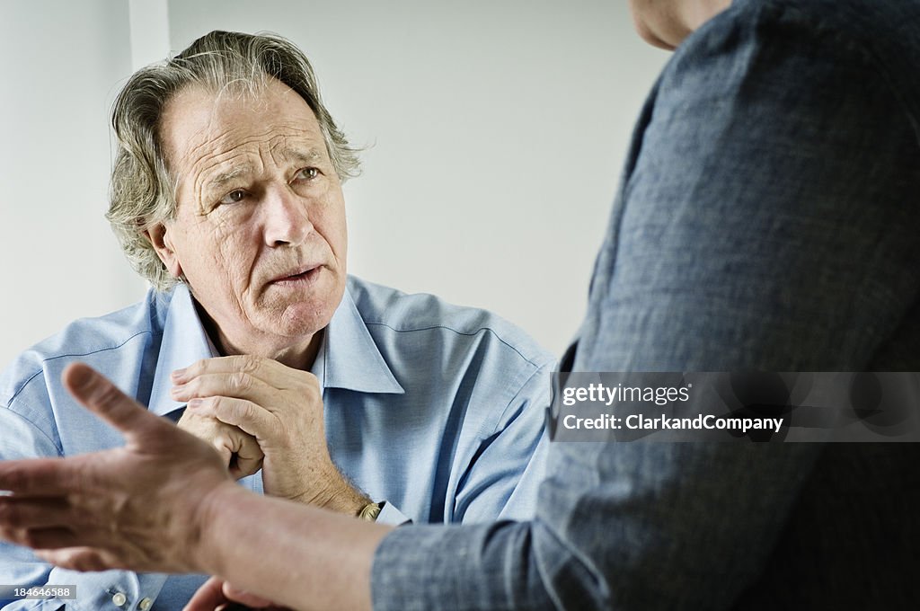 Mature Male talking To a Counsellor