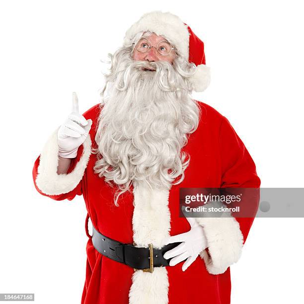 close up of jolly santa on white background pointing up. - santa beard stock pictures, royalty-free photos & images