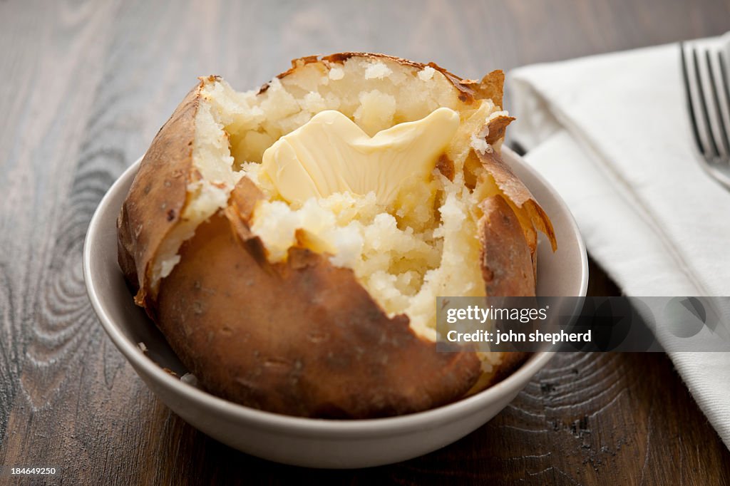 Baked potato with melting butter