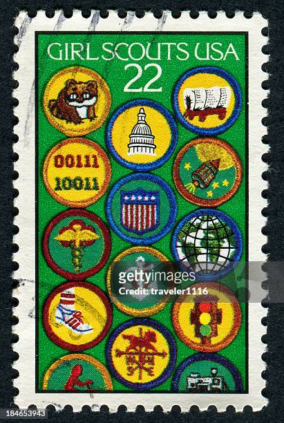 cancelled stamp of the girl scouts usa - girl guides badges stockfoto's en -beelden