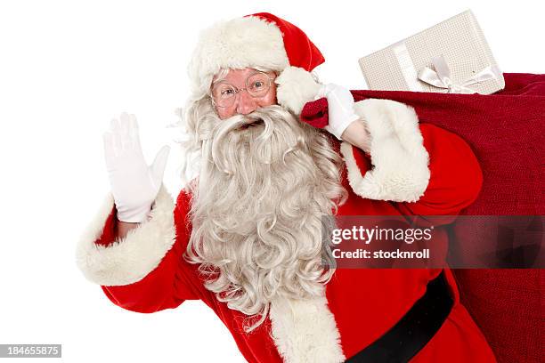 portrait of jolly santa with bag on white background. - santa waving stock pictures, royalty-free photos & images