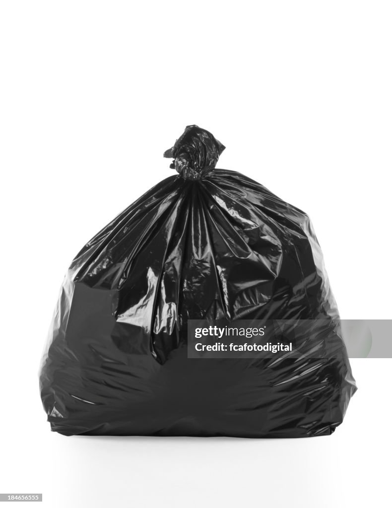Full, tied trash bag on white background