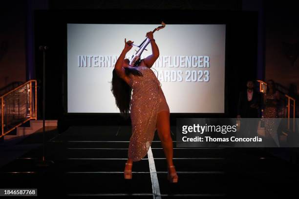 Tamara Sieviieda performs on stage at the International Influencer Awards 2023 at Eden Roc Miami Beach on December 10, 2023 in Miami Beach, Florida.