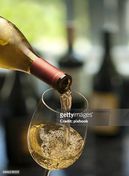 pouring wine - chardonnay grape stock pictures, royalty-free photos & images