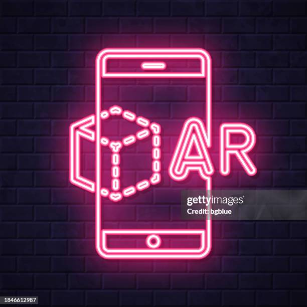 ar augmented reality with smartphone. glowing neon icon on brick wall background - 360 tablet stock illustrations