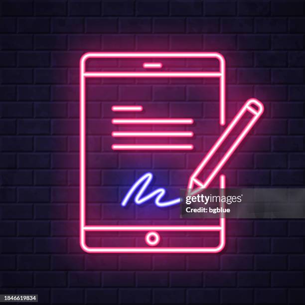 electronic signature on tablet pc. glowing neon icon on brick wall background - touch screen wall stock illustrations