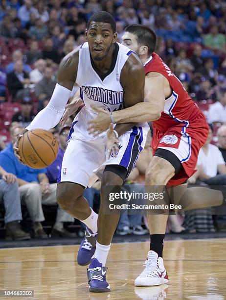 Sacramento Kings power forward Jason Thompson is fouled by Los Angeles Clippers center Byron Mullens in their preseason game on Monday, October 14,...