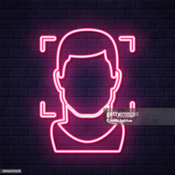 facial recognition with man. glowing neon icon on brick wall background - security camera night stock illustrations