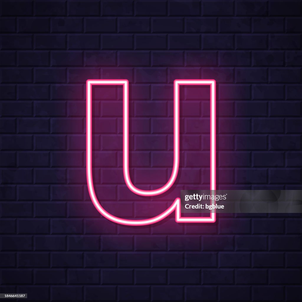 Letter u. Glowing neon icon on brick wall background