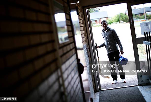 Somali player arrives to the Somali national Bandy team's training session on September 24, 2013 in the city of Borlaenge, Sweden. Somali refugees in...