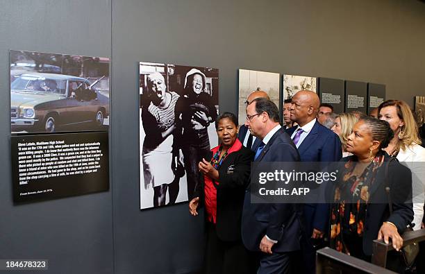 French President François Hollande listens to Antoinette Sithole , sister of the first victim of the June 16 Soweto uprising Hector Pietersen, at the...